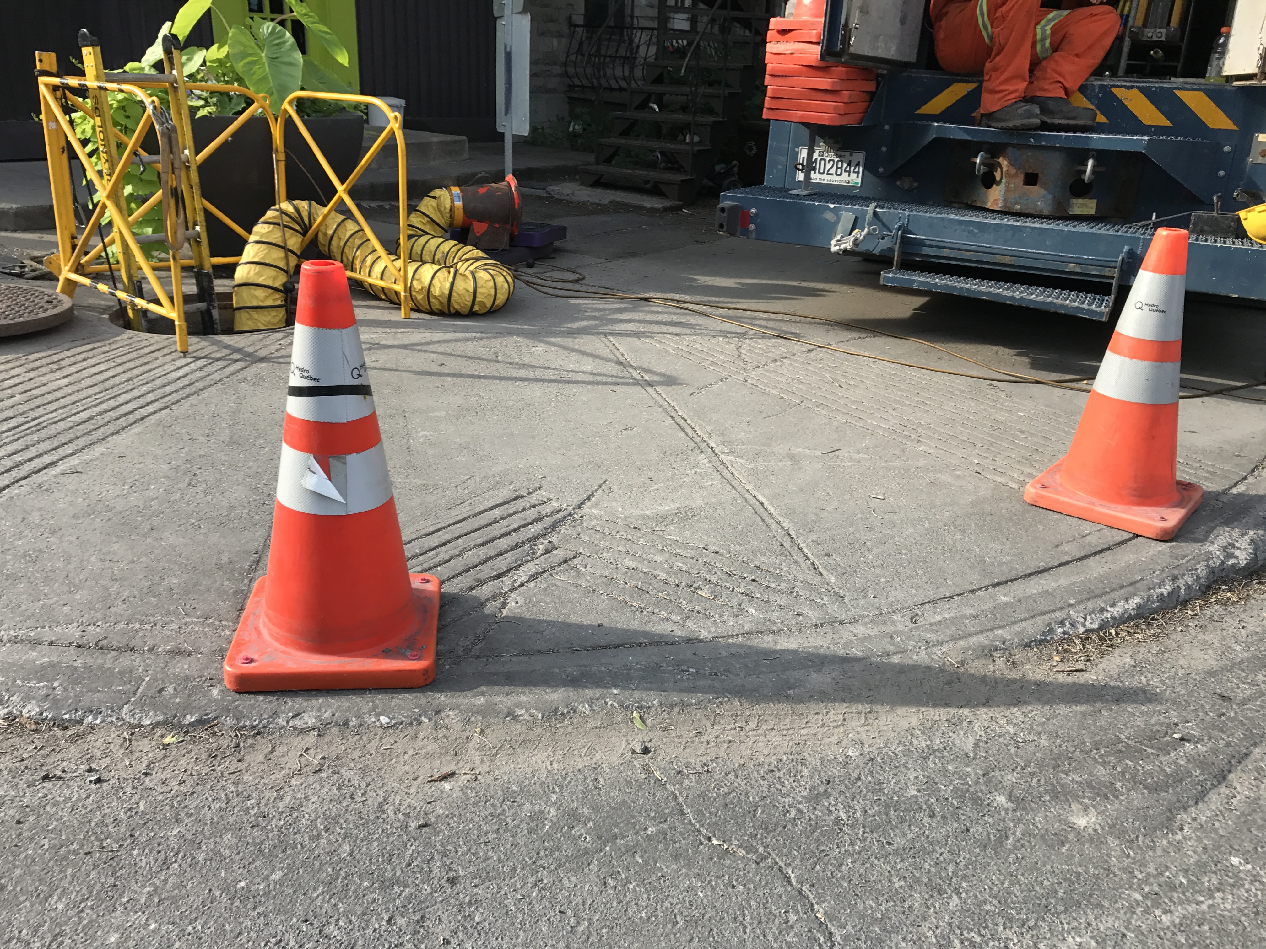 Hydro-Québec van parked on the sidewalk.