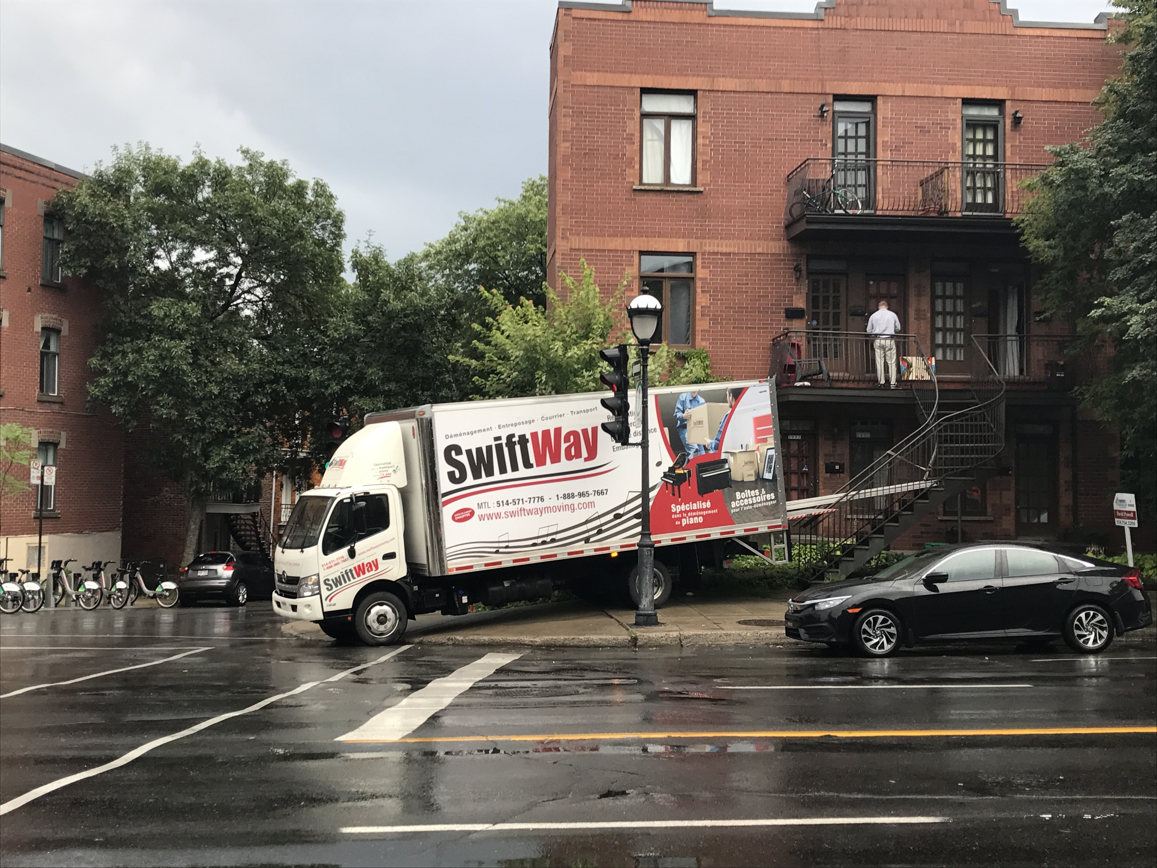 SwiftWay moving truck blocking the sidewalk