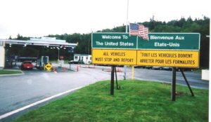 Sign posts at a border crossing between Canada and the United States